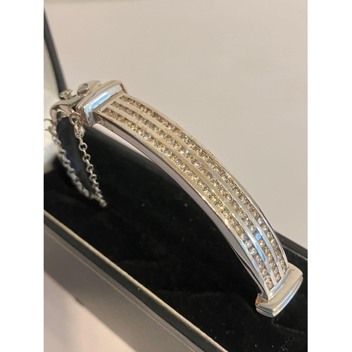 126 - Magnificent DIAMOND set WHITE GOLD BANGLE. Consisting a 9 CARAT W/GOLD BANGLE with  1.5 CARAT of CHA... 