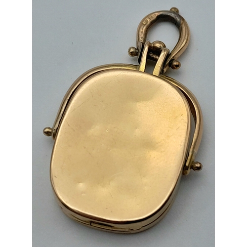 39 - An 18K Yellow Gold Spinning Fob Pendant. 3.5cm. 9.4g