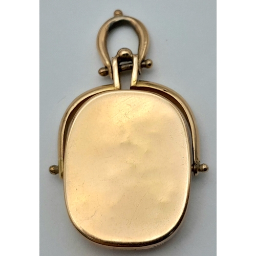 39 - An 18K Yellow Gold Spinning Fob Pendant. 3.5cm. 9.4g