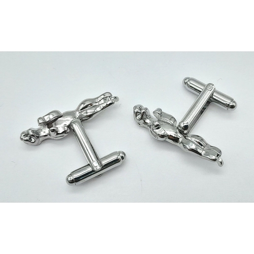 244 - A quality pair of JAGUAR cufflinks in a jeweller’s presentation box. Jaguar length: 30 mm.