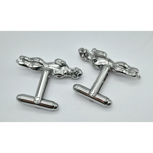 244 - A quality pair of JAGUAR cufflinks in a jeweller’s presentation box. Jaguar length: 30 mm.