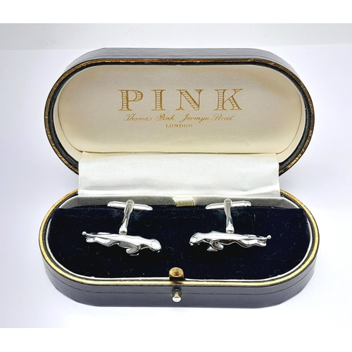 244 - A quality pair of JAGUAR cufflinks in a jeweller’s presentation box. Jaguar length: 30 mm.