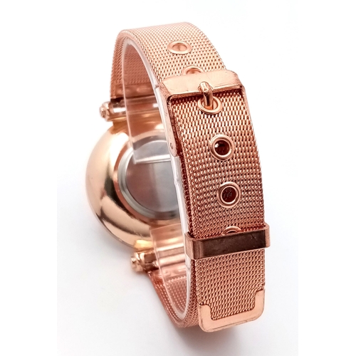 264 - A fancy, rose gold plated watch with diamante in the sub-bezel zone. Case 35 mm, quartz movement wit... 