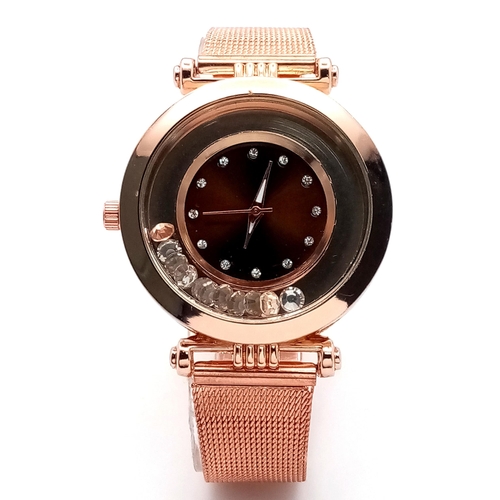 264 - A fancy, rose gold plated watch with diamante in the sub-bezel zone. Case 35 mm, quartz movement wit... 