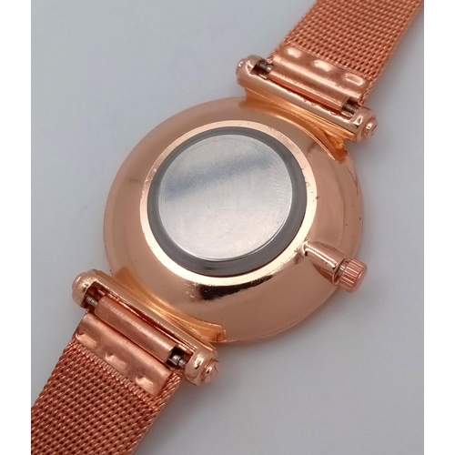 264 - A fancy, rose gold plated watch with diamante in the sub-bezel zone. Case 35 mm, quartz movement wit... 