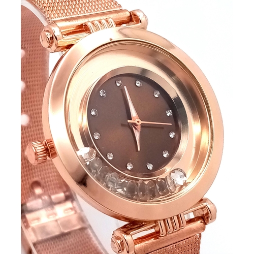 264 - A fancy, rose gold plated watch with diamante in the sub-bezel zone. Case 35 mm, quartz movement wit... 