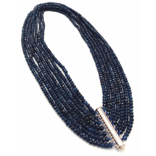 271 - A magnificent, seven row necklace with faceted dark blue sapphire rondelles. Length: 43-54 cm, weigh... 