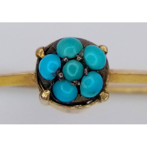 82 - An Antique 18K Gold and Turquoise Small Bar Brooch. 3cm. 0.85g total weight.