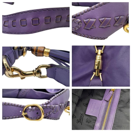 1192 - A Gucci Purple Leather Jackie Tote Bag. Decorated with bamboo tassels and gold tone hardware. Remova... 