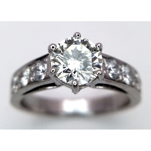 1296 - A 14K White Gold, Head-Turning Fancy Diamond Ring. A 1ct brilliant round cut yellow diamond with 0.6... 