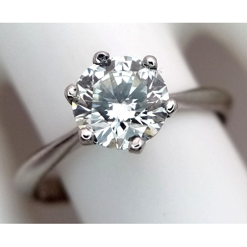 1303 - A Platinum Diamond Solitaire Ring. A 1.25ct Brilliant round cut diamond - SI1 clarity. Size P. 4g to... 