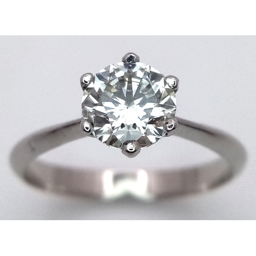 1303 - A Platinum Diamond Solitaire Ring. A 1.25ct Brilliant round cut diamond - SI1 clarity. Size P. 4g to... 