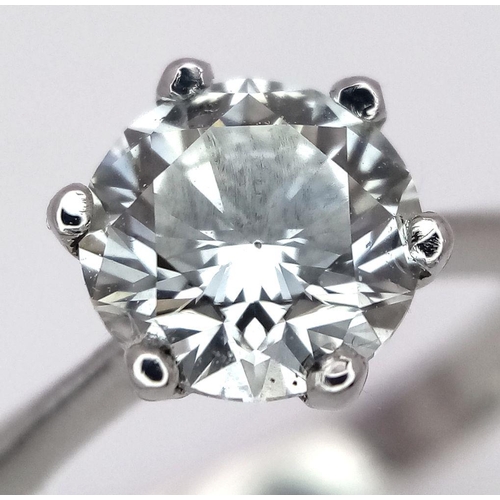 1303 - A Platinum Diamond Solitaire Ring. A 1.25ct Brilliant round cut diamond - SI1 clarity. Size P. 4g to... 