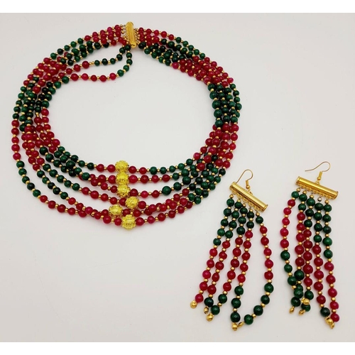 257 - A substantial six row necklace with green and red jade highly polished beads in a geometric design, ... 