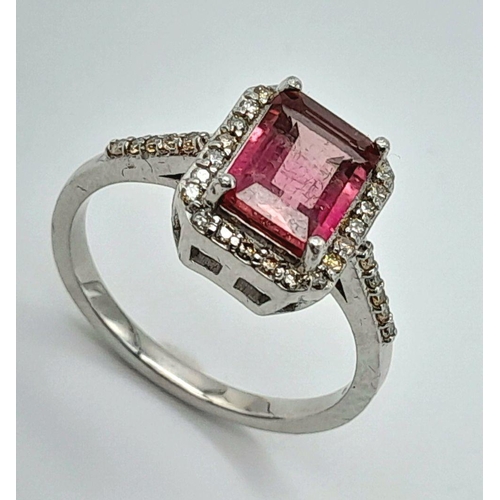 277 - A 925 silver ring featuring a 2ct emerald-cut pink tourmaline, surrounded by a halo of diamonds and ... 