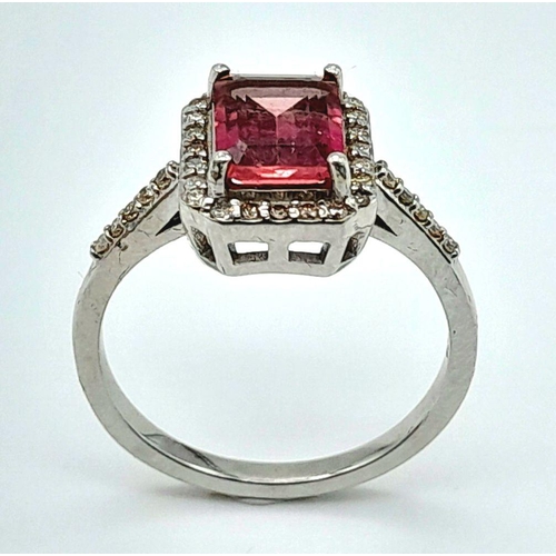 277 - A 925 silver ring featuring a 2ct emerald-cut pink tourmaline, surrounded by a halo of diamonds and ... 