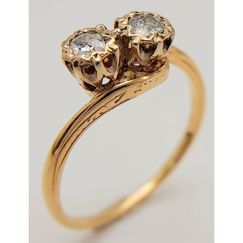 300 - A 14K Yellow Gold Diamond Crossover Ring. 0.40ctw of brilliant round cut diamonds. Size L. 2.3g tota... 