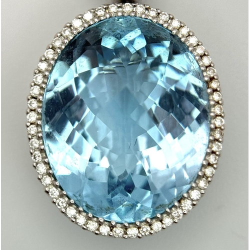 38 - A Gorgeous London Topaz and Diamond Pendant. 15ctw of Round and Oval Cut Ice Blue Topaz with Diamond... 