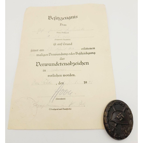 582 - A WW2 German 3rd Class Wound Badge in Black Representing Iron & Award Certificate to a soldier in th... 