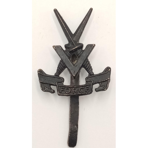 659 - A WW2 Middle Eastern Made “V” Force Cap Badge. V Force was envisaged as a 