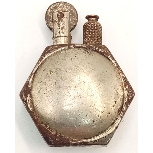 765 - A WW1 Trench Art Lighter Made from an Aircraft Nut with a Royal Flying Corps Badge soldiered onto th... 