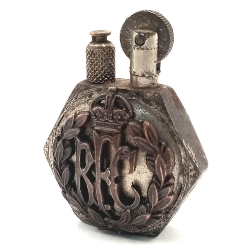 765 - A WW1 Trench Art Lighter Made from an Aircraft Nut with a Royal Flying Corps Badge soldiered onto th... 