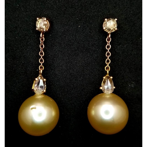 771 - A Pair of Golden South Sea Pearl and Diamond Earrings. Set in 18k Gold. Pearl - 12mm. Diamonds, pear... 