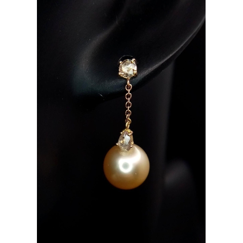 771 - A Pair of Golden South Sea Pearl and Diamond Earrings. Set in 18k Gold. Pearl - 12mm. Diamonds, pear... 