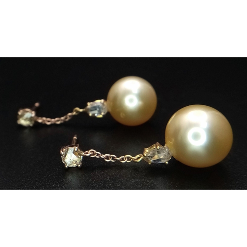 771 - A Pair of Golden South Sea Pearl and Diamond Earrings. Set in 18k Gold. Pearl - 12mm. Diamonds, pear... 