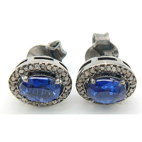 931 - A pair of 925 silver kyanite gemstone stud earrings, featuring central oval-cut kyanite gemstones, s... 