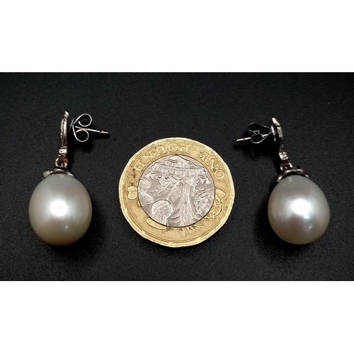 463 - A Pair of Vintage 18K White Gold, Diamond and Pearl Earrings. Large 15mm oval pearls. 8.1g total wei... 