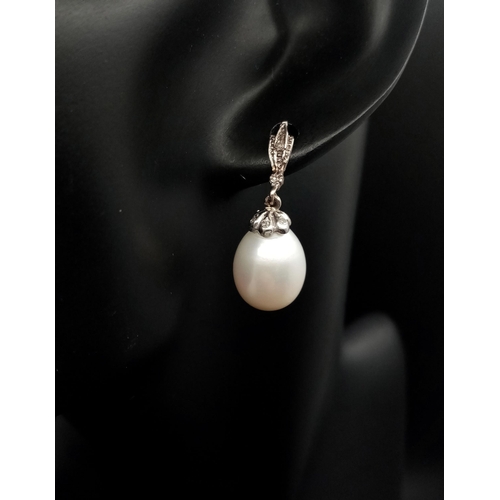 463 - A Pair of Vintage 18K White Gold, Diamond and Pearl Earrings. Large 15mm oval pearls. 8.1g total wei... 