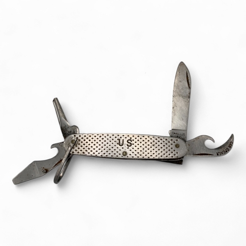 1023 - A Vietnam war era Camillus 1965 U.S. Military Pocket Knife, consists of four foldable tools: a blade... 