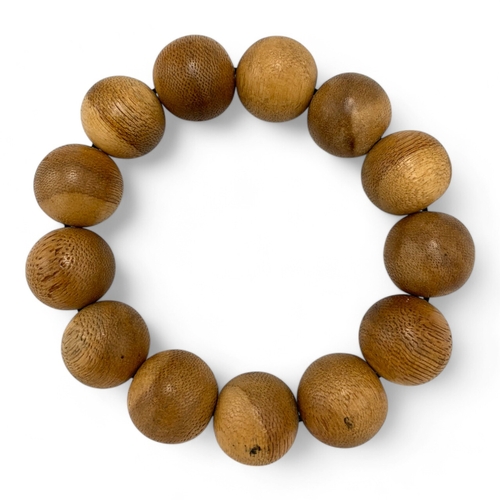 1156 - A Natural Agarwood Bead Bracelet.
The natural agarwood fragrance is well known for its purposes in r... 