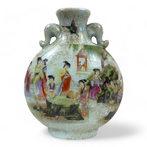 1170 - An antique Chinese Famille Rose Crackle-Glaze Vase. 
Crackled porcelain exterior featuring colorful ... 