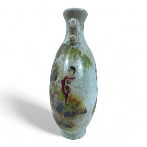 1170 - An antique Chinese Famille Rose Crackle-Glaze Vase. 
Crackled porcelain exterior featuring colorful ... 