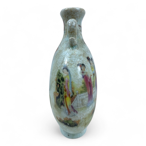 1170 - An antique Chinese Famille Rose Crackle-Glaze Vase. 
Crackled porcelain exterior featuring colorful ... 