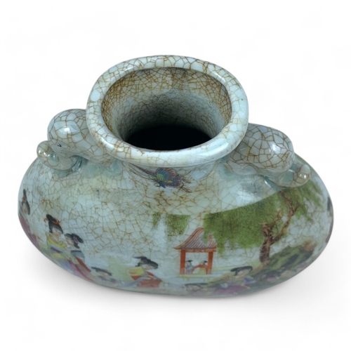 1170 - An antique Chinese Famille Rose Crackle-Glaze Vase. 
Crackled porcelain exterior featuring colorful ... 