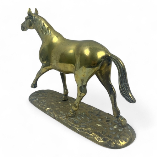 946 - A large Vintage solid bronze Horse Figurine. Polished bronze with a hammered base and detailed craft... 