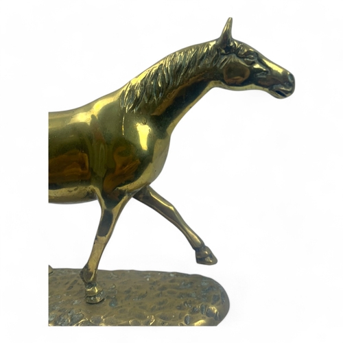 946 - A large Vintage solid bronze Horse Figurine. Polished bronze with a hammered base and detailed craft... 