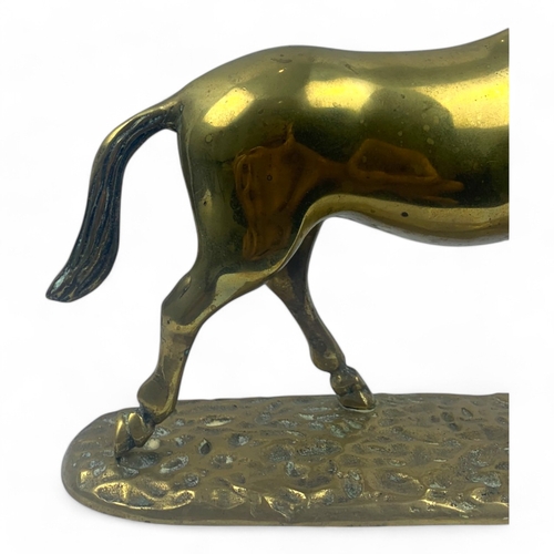 946 - A large Vintage solid bronze Horse Figurine. Polished bronze with a hammered base and detailed craft... 