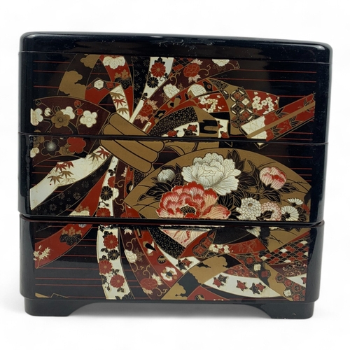 960 - An antique Japanese Lacquered wooden Box Set.
Hand painted lacquerware exterior with intricate flora... 