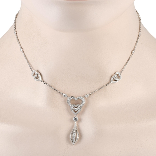 137 - A Cartier 18K White Gold 1.85ct Diamond Heart Necklace. Add charm and sophistication to any ensemble... 