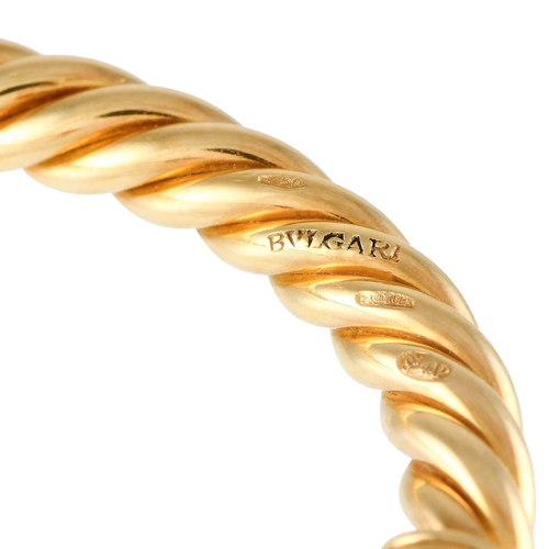 397 - A Bvlgari 18K Yellow Gold Tourmaline Bracelet. Designed as a rigid twisted rope cuff with open ends.... 