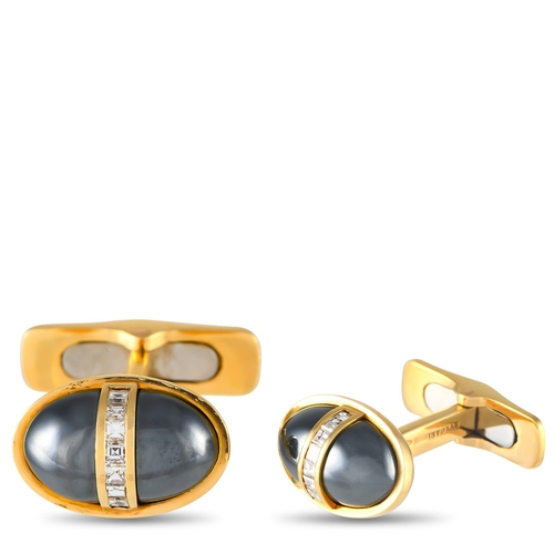 657 - A pair of  Bvlgari 18K Yellow Gold 0.30ct Diamond and Hematite Cufflinks. The oval shaped design is ... 