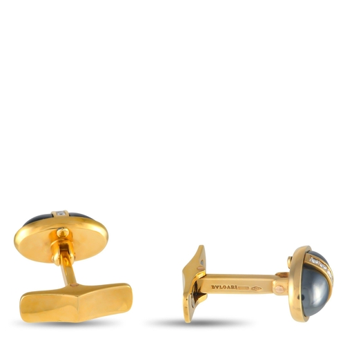 657 - A pair of  Bvlgari 18K Yellow Gold 0.30ct Diamond and Hematite Cufflinks. The oval shaped design is ... 