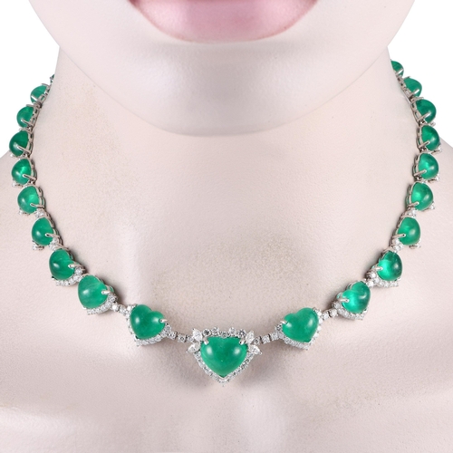 67 - A Platinum 5.84ct Diamond and Emerald Heart Necklace. Heart-shaped emerald gemstones totaling 70.9 c... 