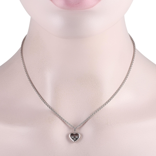 678 - A Chopard Happy Diamonds 18K White Gold Diamond Heart Necklace. It features a heart-shaped white gol... 