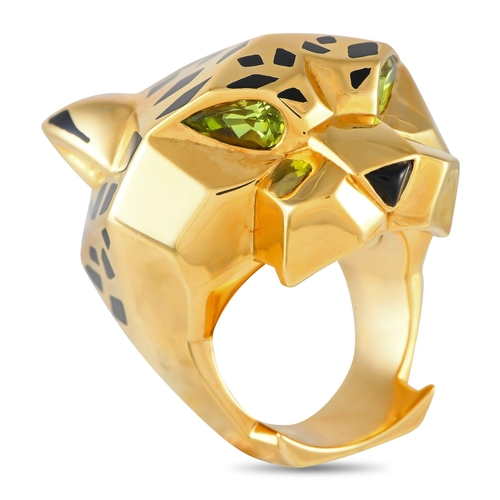 74 - An iconic Cartier Panthere 18K Yellow Gold Lacquer Ring. Black lacquer accents and green gemstone ey... 