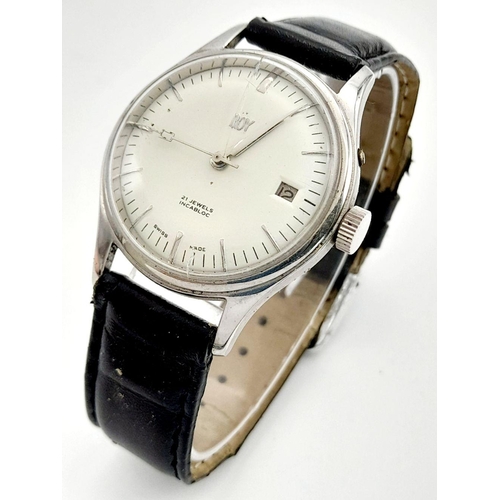 954 - An Early Swiss Made Roy Watch. 35mm case. White dial with date box. Black leather strap (could do wi... 